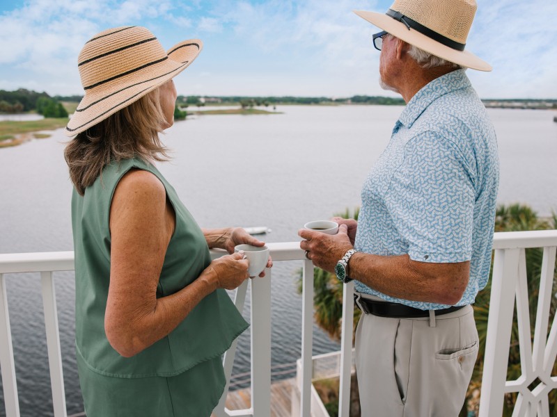 WFI Couple Looking At Water On Balcony May2025